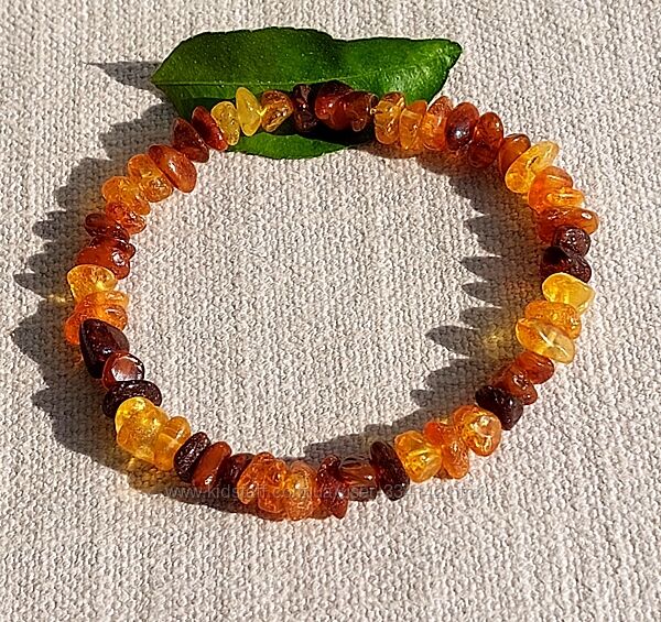 Яскравий янтарний браслет із комбінованого прозорого бурштину