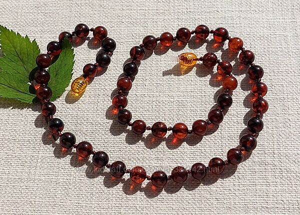 Розкішне янтарне намисто із темно коньячних бурштинових кульок 7 мм