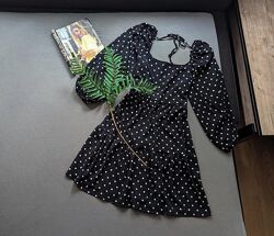 Фактурна ярусна сукня в горох з об&acuteємними рукавами