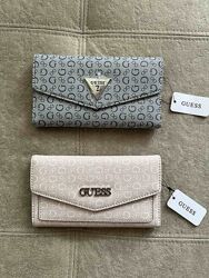 Жіночі гаманці, косметички Guess 