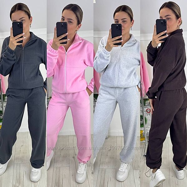 Костюм штани прямі, затягуються на резинку знизу, кофта застібається на бли